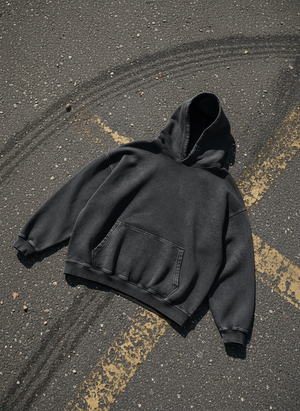VALERO ImpactFade Hoodie in washed black, laid flat showing the garment wash and heavy fleece